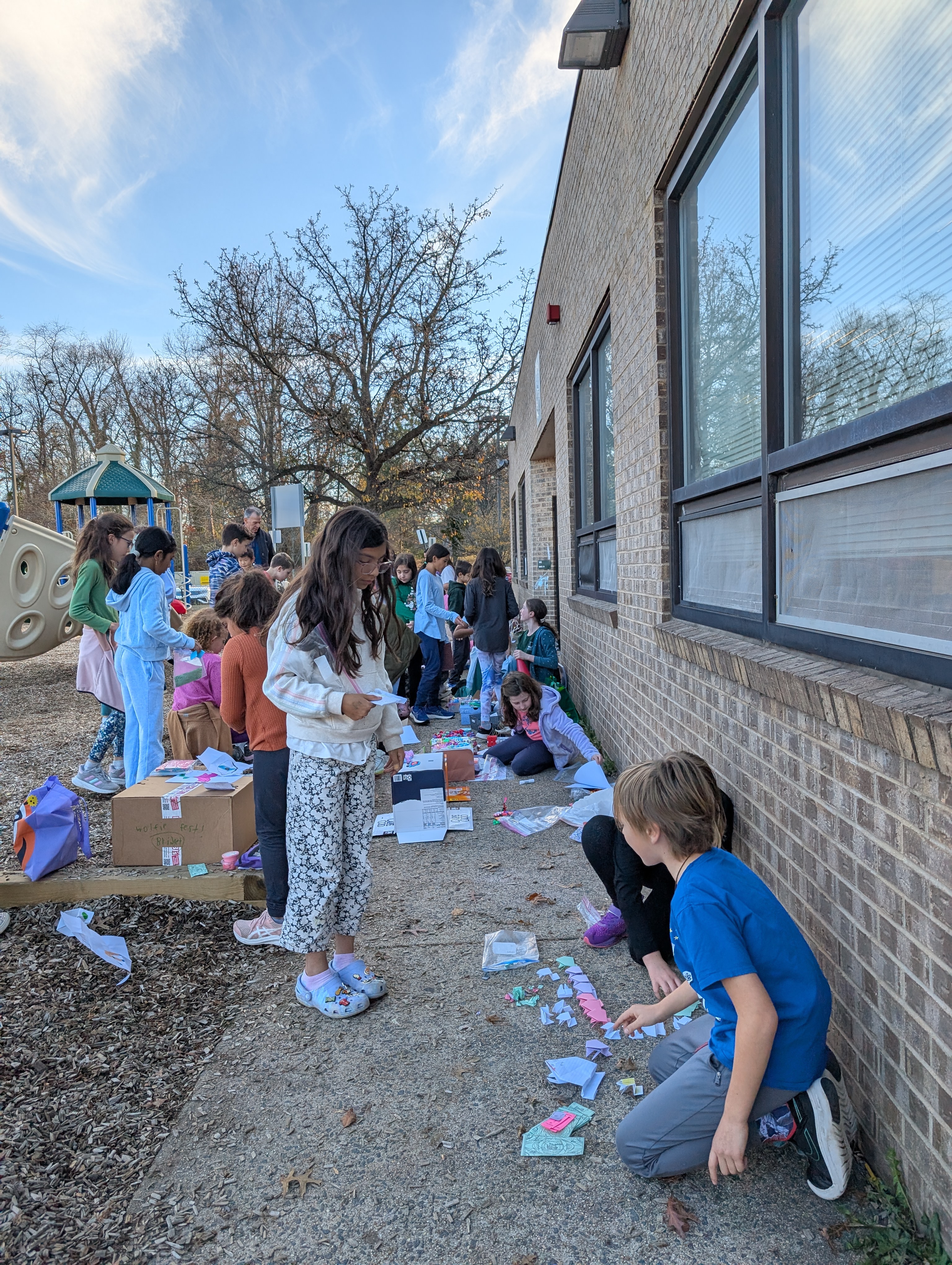 Students outside practicing buying and selling